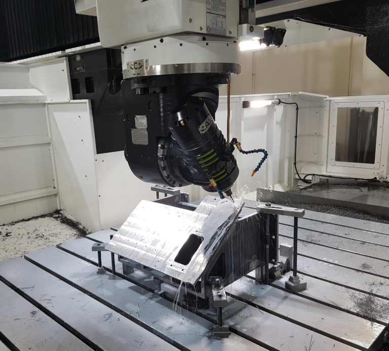 CNC machine in action milling metal